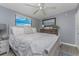 Bedroom with soft decor, natural light, and a light color scheme at 70 Virginia Ct, Englewood, FL 34223