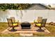 Outdoor firepit seating area with comfortable chairs, perfect for enjoying cool evenings and outdoor gatherings at 70 Virginia Ct, Englewood, FL 34223