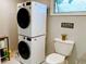 Modern stacked washer and dryer conveniently located in the updated laundry area at 70 Virginia Ct, Englewood, FL 34223