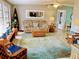 Cozy living room featuring comfortable seating, bright natural light, and stylish coastal-themed decor at 70 Virginia Ct, Englewood, FL 34223