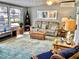 Comfortable living room featuring a plush sofa, area rug and decor at 70 Virginia Ct, Englewood, FL 34223