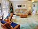 Comfortable living room featuring a plush sofa, area rug and decor at 70 Virginia Ct, Englewood, FL 34223