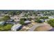 Aerial shot of a residential neighborhood showcasing neatly arranged homes, mature trees, and a well-connected street layout at 22131 Bahama Ave, Port Charlotte, FL 33952