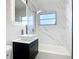 This bathroom has a modern sink, marbled walls, and shower at 22131 Bahama Ave, Port Charlotte, FL 33952