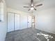 This bedroom features tile floors and a ceiling fan at 22131 Bahama Ave, Port Charlotte, FL 33952