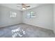 Bedroom with tile floor, natural light, and ceiling fan at 22131 Bahama Ave, Port Charlotte, FL 33952