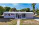 Charming single-story home featuring a screened entryway and a well-maintained front yard at 22131 Bahama Ave, Port Charlotte, FL 33952