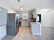 Renovated kitchen with stainless appliances and light gray cabinetry at 22131 Bahama Ave, Port Charlotte, FL 33952