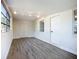 Bright living room featuring hardwood floors and multiple windows at 22131 Bahama Ave, Port Charlotte, FL 33952