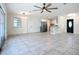 Open living room is bright and features the kitchen, dining, and decorative front door at 22131 Bahama Ave, Port Charlotte, FL 33952