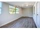 Bright living room featuring hardwood floors and multiple windows at 22131 Bahama Ave, Port Charlotte, FL 33952