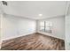 A bright bedroom boasts wood floors and a large window allowing ample natural light at 3419 Pleasant Lake Dr, Tampa, FL 33618