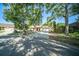 Pleasant one-story house with a spacious driveway and an attractive front lawn at 3419 Pleasant Lake Dr, Tampa, FL 33618