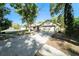 A cozy single-Gathering home with a two-car garage, complemented by verdant trees at 3419 Pleasant Lake Dr, Tampa, FL 33618