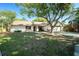 Inviting single-Gathering home showcasing a lush front yard and attached two-car garage at 3419 Pleasant Lake Dr, Tampa, FL 33618