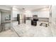 Bright kitchen features stainless steel appliances, granite countertops, and white cabinetry at 3419 Pleasant Lake Dr, Tampa, FL 33618