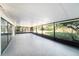 Large screened lanai with tiled floor, providing an outdoor living space at 3419 Pleasant Lake Dr, Tampa, FL 33618