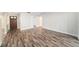 Inviting living room showcases beautiful wood floors and a view of the front door at 3419 Pleasant Lake Dr, Tampa, FL 33618