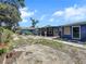 Shows multiple buildings with exterior of blue and gray paint at 5213 Keene Dr, Plant City, FL 33566