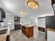 Modern kitchen with an island, stainless steel appliances, and an open floorplan at 5213 Keene Dr, Plant City, FL 33566