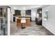 Modern kitchen featuring an island, stainless steel appliances, and stylish floors at 5213 Keene Dr, Plant City, FL 33566