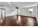 Large living room with hardwood floors, recessed lighting, and ample natural light from large windows at 5213 Keene Dr, Plant City, FL 33566