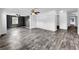 Bright living room featuring stylish floors, ceiling fans, and neutral paint colors at 5213 Keene Dr, Plant City, FL 33566