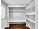 Mud room featuring storage shelves, a bench, and access to the exterior at 5213 Keene Dr, Plant City, FL 33566