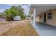Home's backyard features a covered patio and storage shed at 1409 N Garden Ave, Clearwater, FL 33755