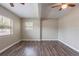Bedroom features natural light, wood-look flooring and a ceiling fan at 1409 N Garden Ave, Clearwater, FL 33755