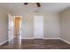 Bright bedroom featuring wood-look floors, neutral walls, and two entry doors at 1409 N Garden Ave, Clearwater, FL 33755