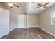 Bright bedroom with wood-look floors, neutral walls, and a convenient closet at 1409 N Garden Ave, Clearwater, FL 33755