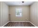 Bedroom featuring wood-look flooring, neutral walls and good natural light at 1409 N Garden Ave, Clearwater, FL 33755