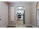 Efficient kitchen featuring white cabinets, stainless steel appliances, and wood-style flooring at 1409 N Garden Ave, Clearwater, FL 33755