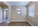 Living area with wood-style flooring and archway into another room at 1409 N Garden Ave, Clearwater, FL 33755