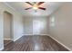 Inviting living room featuring wood flooring, neutral walls, and a bright white front door at 1409 N Garden Ave, Clearwater, FL 33755