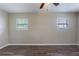 Cozy living room with light walls, wood flooring, and bright window at 1409 N Garden Ave, Clearwater, FL 33755