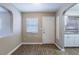 Bright area with wood flooring, and view of the kitchen through an archway at 1409 N Garden Ave, Clearwater, FL 33755