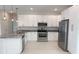 Contemporary kitchen featuring stainless steel appliances, ample cabinet space, and recessed lighting at 4150 Windsong Ave, North Port, FL 34287