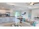 Inviting living room with a modern kitchen, dining area, and stylish decor at 4150 Windsong Ave, North Port, FL 34287