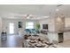 Comfortable living room with a view of the kitchen, dining area, and outdoor access at 4150 Windsong Ave, North Port, FL 34287