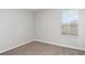 Bedroom with neutral walls, carpet, and a window with natural light at 541 Vista Ridge Dr, Ruskin, FL 33570