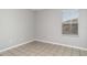 Neutral bedroom with tile flooring and a bright window letting in natural light at 541 Vista Ridge Dr, Ruskin, FL 33570