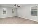 Bedroom with carpet flooring, neutral walls, and two windows for natural light at 541 Vista Ridge Dr, Ruskin, FL 33570
