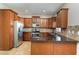 Well-equipped kitchen with stainless steel appliances, granite countertops, and abundant wood cabinetry at 541 Vista Ridge Dr, Ruskin, FL 33570