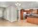 Open kitchen featuring stainless steel appliances, wooden cabinets, and a convenient island for meal prep at 541 Vista Ridge Dr, Ruskin, FL 33570