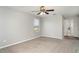 Main bedroom featuring carpet flooring, a ceiling fan, and a bathroom ensuite at 541 Vista Ridge Dr, Ruskin, FL 33570