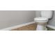 Close up of the toilet in a half bath with neutral walls and tile floor at 541 Vista Ridge Dr, Ruskin, FL 33570