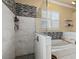 Elegant bathroom showcasing a soaking tub, a glass shower, and tasteful tile accents at 2818 Mossy Timber Trl, Valrico, FL 33596
