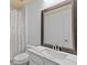 Updated bathroom featuring a large mirror and marble countertop sink at 2818 Mossy Timber Trl, Valrico, FL 33596